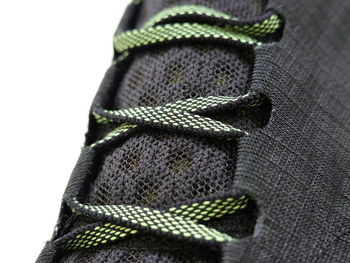 Close-up of textile laces over white background