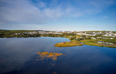 Wonderful view of town located along coast of calm river