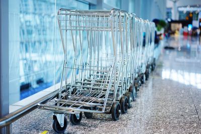 Empty shopping carts in supermarket