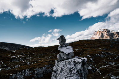 Rocks on mountain against sky