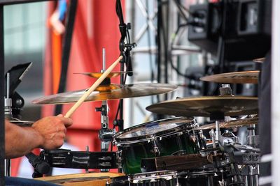 Cropped hands of person playing drums