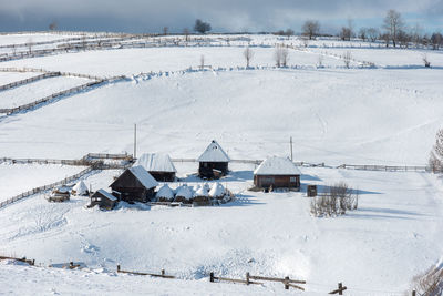 Idyllic winter wonderland mountain scenery with mountain chalet, lodge