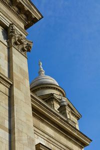 Low angle view of building against blue sky