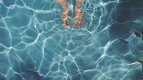 Low section of man in swimming pool