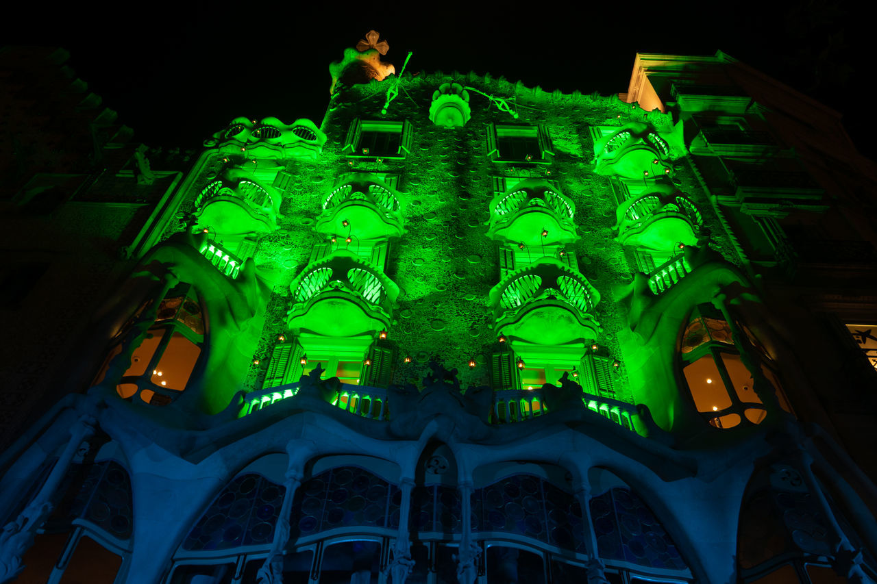 architecture, night, light, low angle view, built structure, illuminated, screenshot, building exterior, green, no people, darkness, travel destinations, building, nature