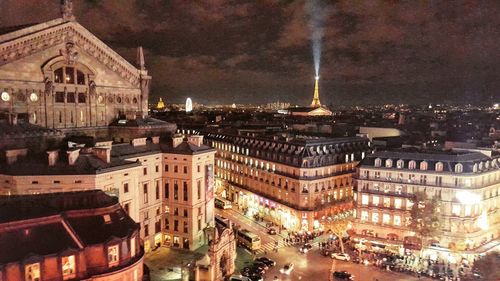 High angle view of buildings in city at night