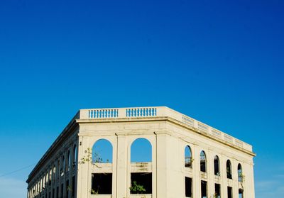 Low angle view of building against blue sky