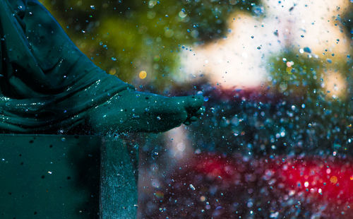 Low section of water drops over sculpture