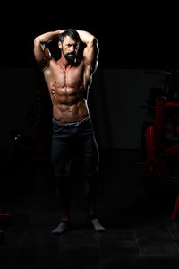 Rear view of man exercising in gym