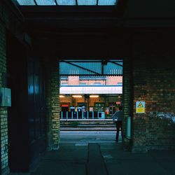 Woman standing in front of building