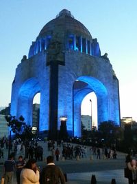 Tourists in front of building