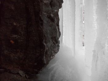 Close-up of frozen ice against sky