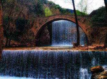 Arch bridge over river