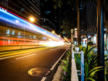 Light trails on street in city at night