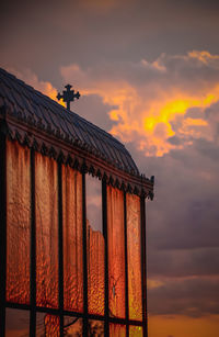 Vault of a tomb in front of a sunset