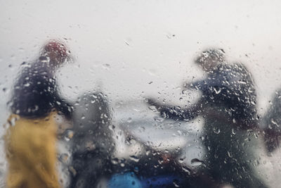 Full frame shot of wet glass window in rainy season