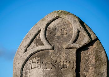 Low angle view of sculpture against clear blue sky