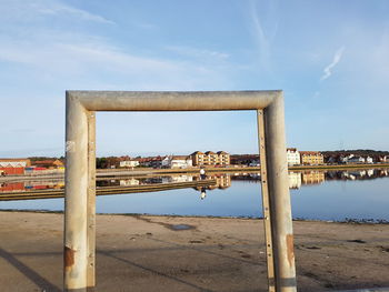 Built structure on beach against sky