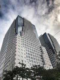 Low angle view of modern buildings against sky