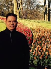 Portrait of man on flower field