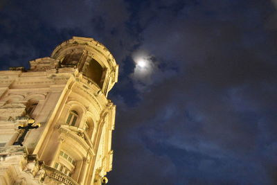 Low angle view of cathedral against cloudy sky