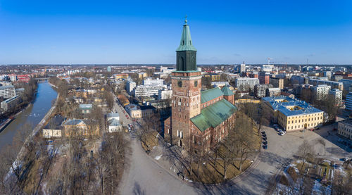 High angle view of cityscape against clear blue sky