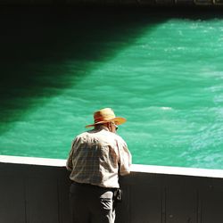 Rear view of man looking at sea