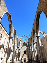 Low angle view of historic building against clear blue sky. carmo convent. lisbon portugal