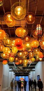 Low angle view of illuminated lanterns hanging on ceiling