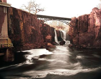 View of bridge over river in city