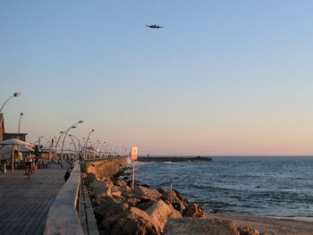 Scenic view of sea against clear sky during sunset