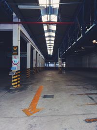 Empty road with buildings in background