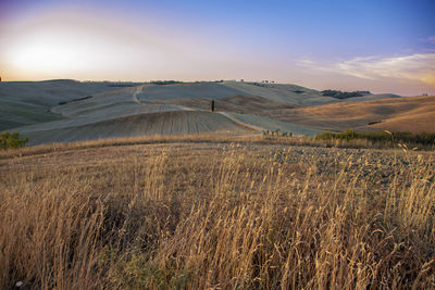 Scenic view of landscape against sky during sunset