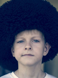 Portrait of boy wearing fur hat