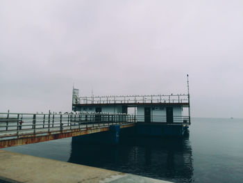 Pier on sea against sky