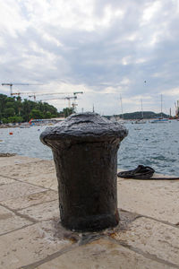 View of wooden post at beach