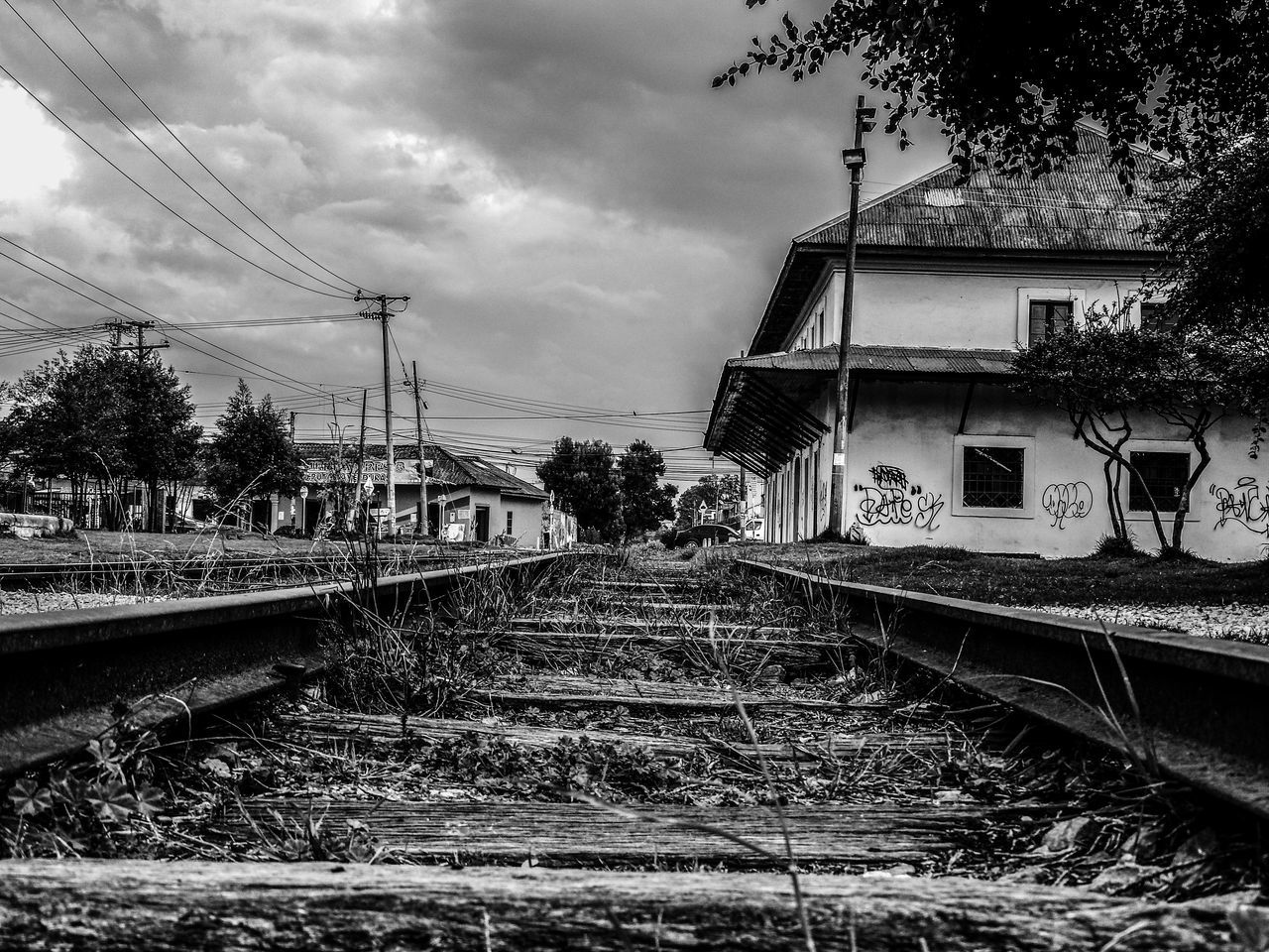 sky, rail transportation, transportation, tree, cloud - sky, railroad track, wet, outdoors, day, no people, water