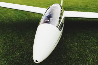 Close-up of airplane in grass