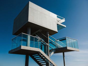 Low angle view of building against clear blue sky