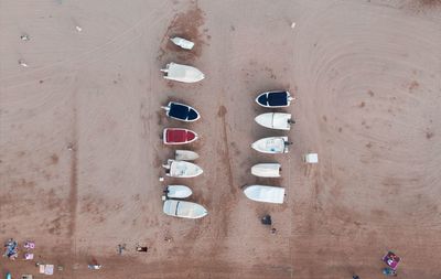 High angle view of moored boats on sand at beach