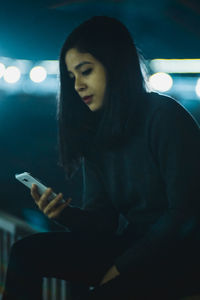 Young woman using smart phone