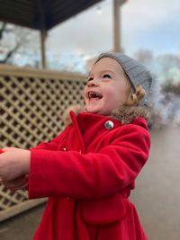 Happy boy standing in park during winter