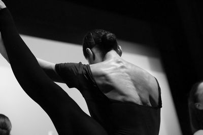 Rear view of ballet dancer practicing in dance studio
