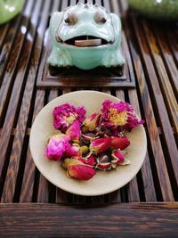 Close-up of pink flowers on table