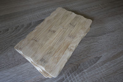 High angle view of cutting boards on wooden table