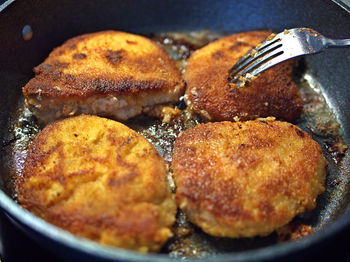 Close-up of meat in cooking pan