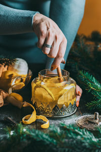 Autumn or winter hot tea with lemon and sugar with steam above the cup on a dark background. 