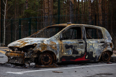 Cars burned down on the street.