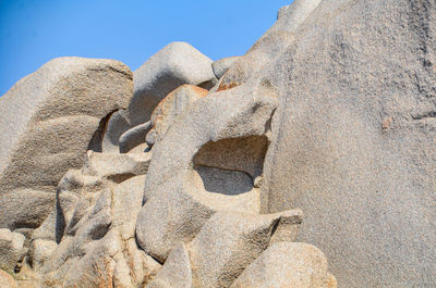 Low angle view of sculpture on rock