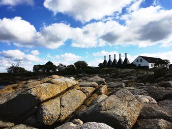 Panoramic view of rocks on land against sky